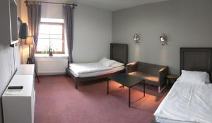 Postel nebo postele na pokoji v ubytování Hotel Antoň