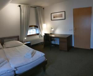 Postel nebo postele na pokoji v ubytování Hotel Antoň