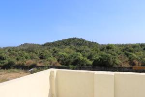 a view of a mountain from the top of a building at Hotel NKC Airport in Chennai