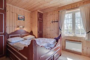 Cama o camas de una habitación en Mugnablikk