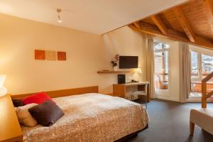 Voodi või voodid majutusasutuse Hotel Allalin Saas-Fee toas