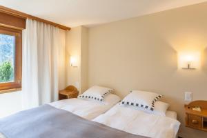 Voodi või voodid majutusasutuse Hotel Allalin Saas-Fee toas