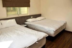 Voodi või voodid majutusasutuse 青·輕旅 toas