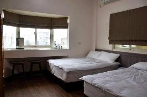 Voodi või voodid majutusasutuse 青·輕旅 toas