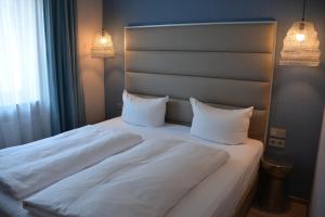 Postel nebo postele na pokoji v ubytování Belle Blue Zentrum