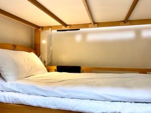 Voodi või voodid majutusasutuse 青·輕旅 toas