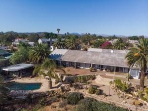an aerial view of a house with a swimming pool at Aloe Manor in Oudtshoorn