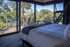 Postel nebo postele na pokoji v ubytování Hillside lodge + 28 fotografií