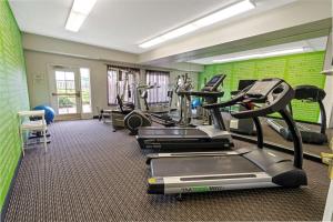 a gym with treadmills and ellipticals in a room at La Quinta by Wyndham Phoenix Scottsdale in Scottsdale