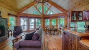 a living room with a couch and a dining room at Southern Comfort in Morganton