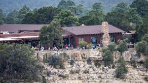 a group of people standing in front of a house at Bright Angel Lodge - Inside the Park in Grand Canyon Village +5 photos