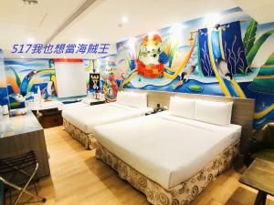 Postel nebo postele na pokoji v ubytování Legend Hotel Kaohsiung Pier2