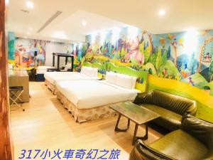 Postel nebo postele na pokoji v ubytování Legend Hotel Kaohsiung Pier2