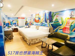 Postel nebo postele na pokoji v ubytování Legend Hotel Kaohsiung Pier2