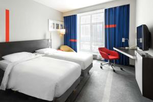 Posteľ alebo postele v izbe v ubytovaní Park Inn by Radisson Hotel Astana