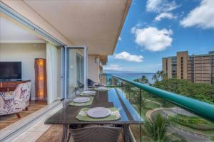 a balcony with a table and a view of the ocean at Honua Kai - Konea 642 - Ocean View from inside! 2b/2b in Kaanapali