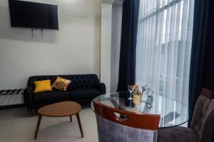 Area tempat duduk di MiniApartamentos GRAN IMPERIAL PREMIUM