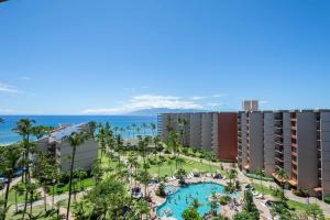 an aerial view of a resort with a pool and the ocean at Kaanapali Shores - 943 in Lahaina