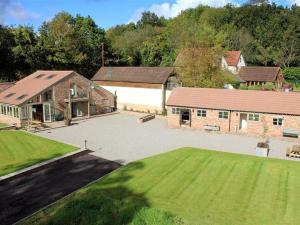 an aerial view of a house with a large driveway at The Old Mill in Flaxley