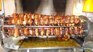 a bunch of food being cooked on a grill at Albergo Ristorante Fratte in Fregona