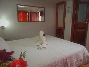 Voodi või voodid majutusasutuse Hostal Tu Hogar toas