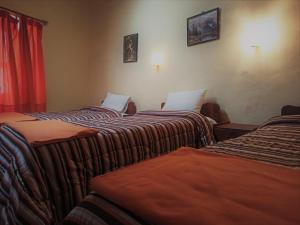 Voodi või voodid majutusasutuse Hostal Tu Hogar toas
