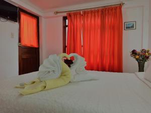 Voodi või voodid majutusasutuse Hostal Tu Hogar toas