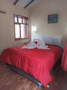 Voodi või voodid majutusasutuse Hostal Tu Hogar toas