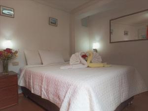 Voodi või voodid majutusasutuse Hostal Tu Hogar toas
