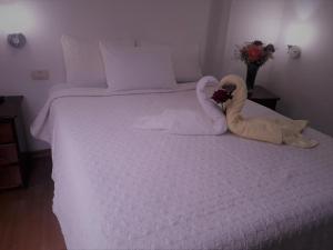 Voodi või voodid majutusasutuse Hostal Tu Hogar toas