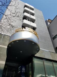 a building with a balcony on top of it at Sun Royal Kawasaki in Kawasaki