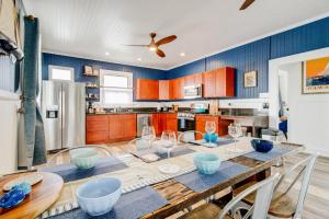 a kitchen with a table with wine glasses on it at NEW Whaler Inn- Nautical Magic Hilo Downtown in Hilo