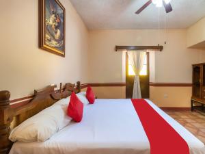 Postel nebo postele na pokoji v ubytování Hacienda Del Angel