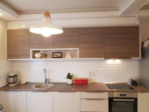 Kuchyň nebo kuchyňský kout v ubytování Modern Apartment Doris