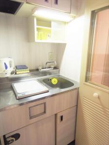 a kitchen with a sink and a counter top at ☆Cozy Japanese style room☆ in Tokyo