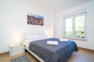 Postel nebo postele na pokoji v ubytování Apartment 'Holiday Above Dubrovnik'