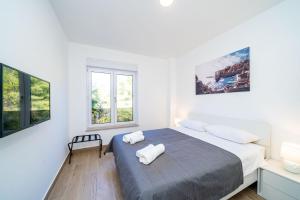 Postel nebo postele na pokoji v ubytování Apartment 'Holiday Above Dubrovnik'