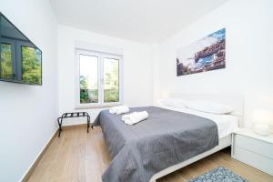 Postel nebo postele na pokoji v ubytování Apartment 'Holiday Above Dubrovnik'