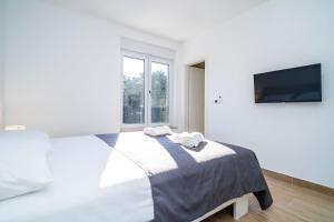 Postel nebo postele na pokoji v ubytování Apartment 'Holiday Above Dubrovnik'