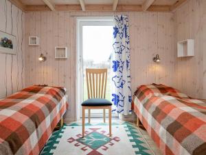 Postel nebo postele na pokoji v ubytování 7 person holiday home in Hjørring-By Traum