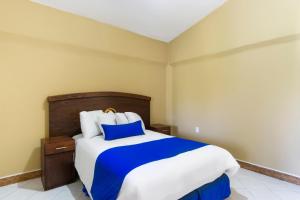 Voodi või voodid majutusasutuse Grand View Suites toas