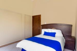 Voodi või voodid majutusasutuse Grand View Suites toas