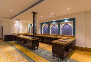 a bathroom with two sinks in a room at Sairafort Sarovar Portico in Jaisalmer