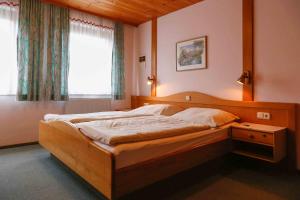 Postel nebo postele na pokoji v ubytování Gästehaus Fidelis