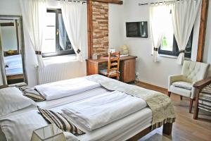 Postel nebo postele na pokoji v ubytování Etno Garden Exclusive Rooms
