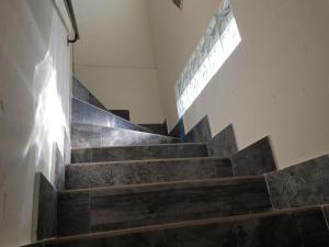 a staircase with wooden steps in a building at Paraiso del Alberche in Navaluenga +31 photos