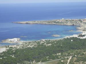 an aerial view of a island in a body of water at Hotel Club Sunway Punta Prima in Es Pujols
