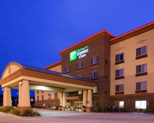 a hotel with a lit up sign on a building at Holiday Inn Express Winona, an IHG Hotel in Winona