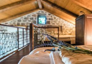 a room with a couch and a window at Palaeopoli Villas in Avlemonas