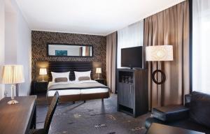 TV a/nebo společenská místnost v ubytování Park Hotel am Berliner Tor